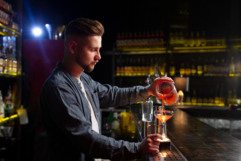 bartender at gin bars in Edinburgh making drink